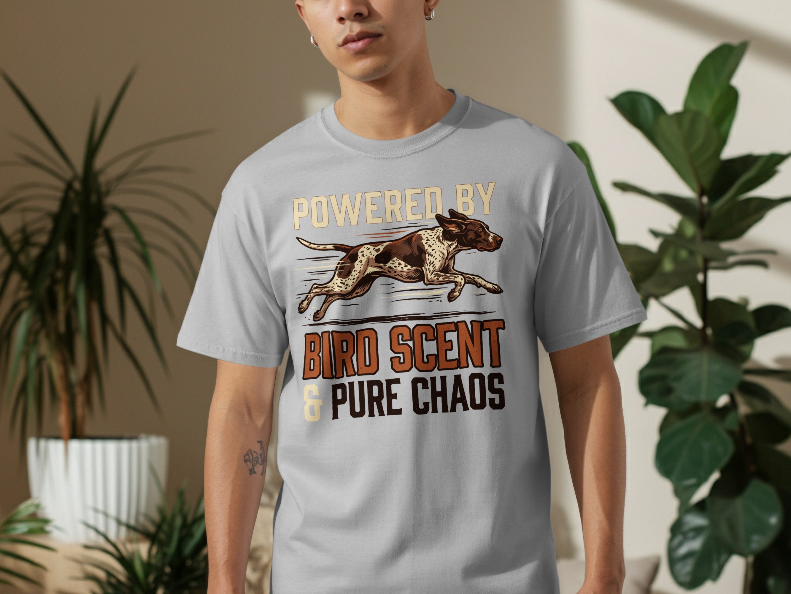 Grey t-shirt with bird dog and "Powered by Bird Scent & Pure Chaos" text.