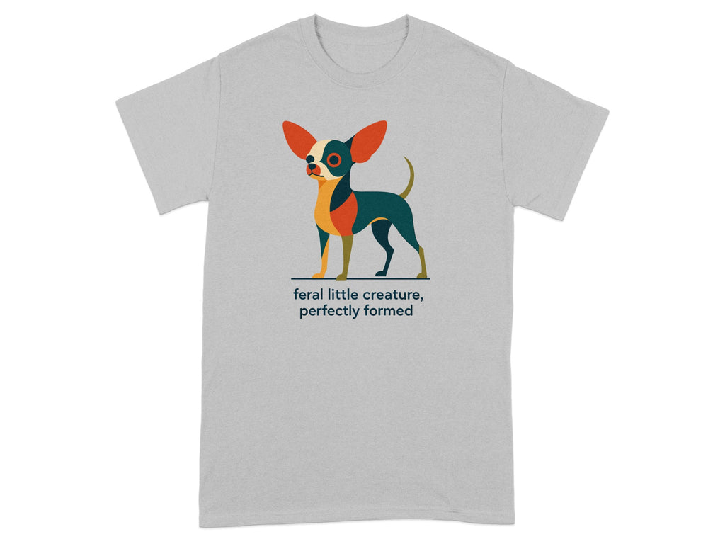 Stylized dog illustration on grey t-shirt with text "feral little creature, perfectly formed".
