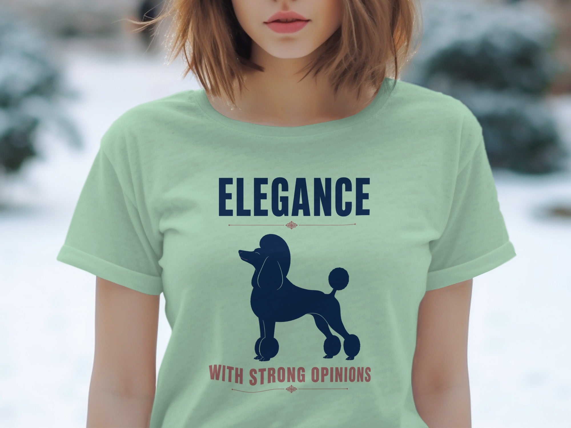 Light green t-shirt with "ELEGANCE WITH STRONG OPINIONS" and poodle graphic.