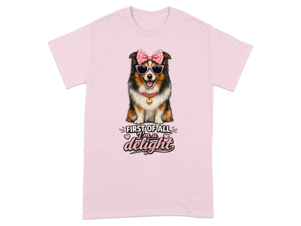 Australian Shepherd dog wearing pink sunglasses and bow, with text "First of all, I'm a delight".