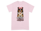 Australian Shepherd dog wearing pink sunglasses and bow, with text "First of all, I'm a delight".