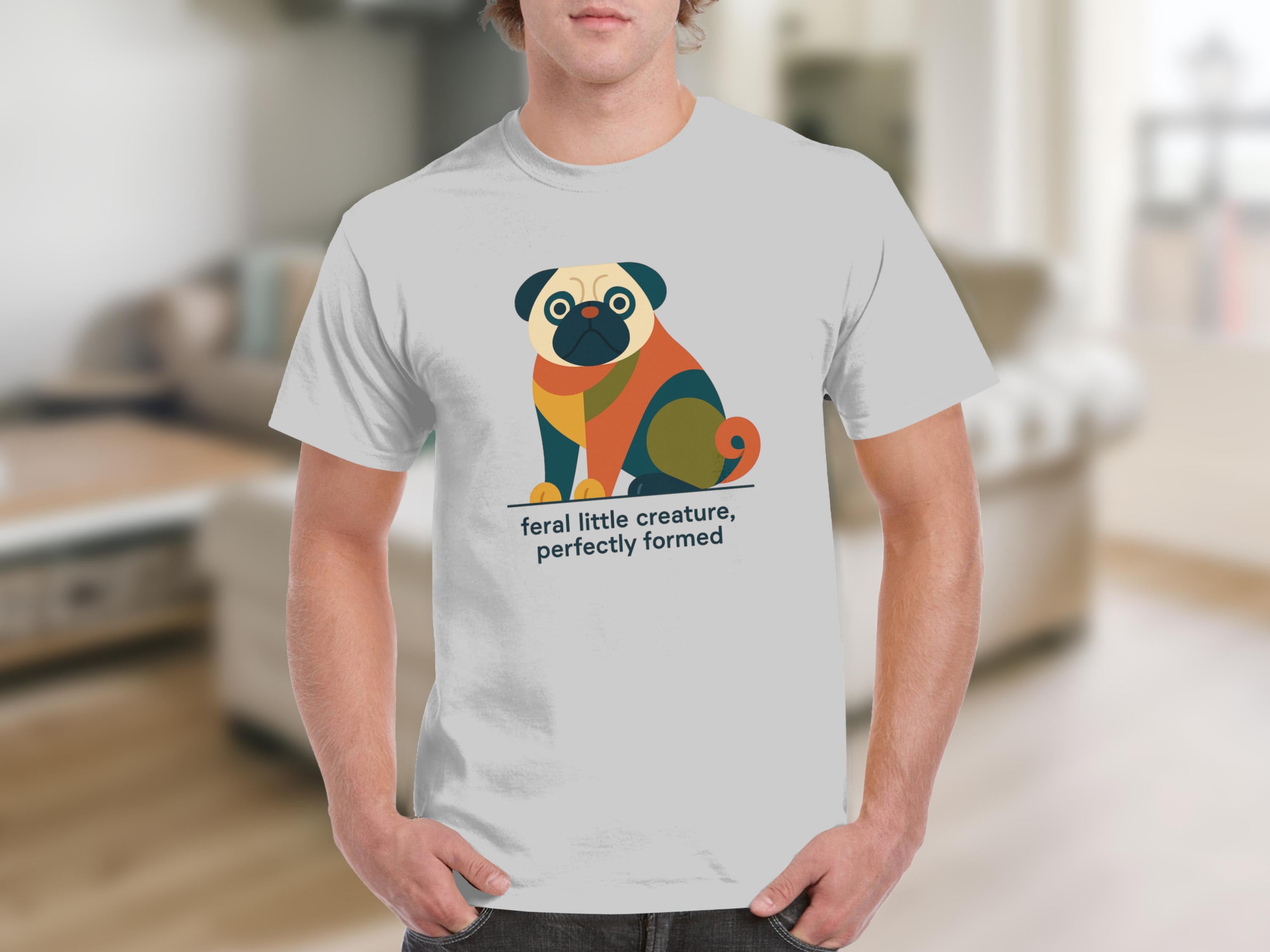 White t-shirt with graphic of a colorful pug and text "feral little creature, perfectly formed".