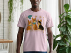 Pink t-shirt with three cartoon corgis sitting on a gold bar with mid-century accents.