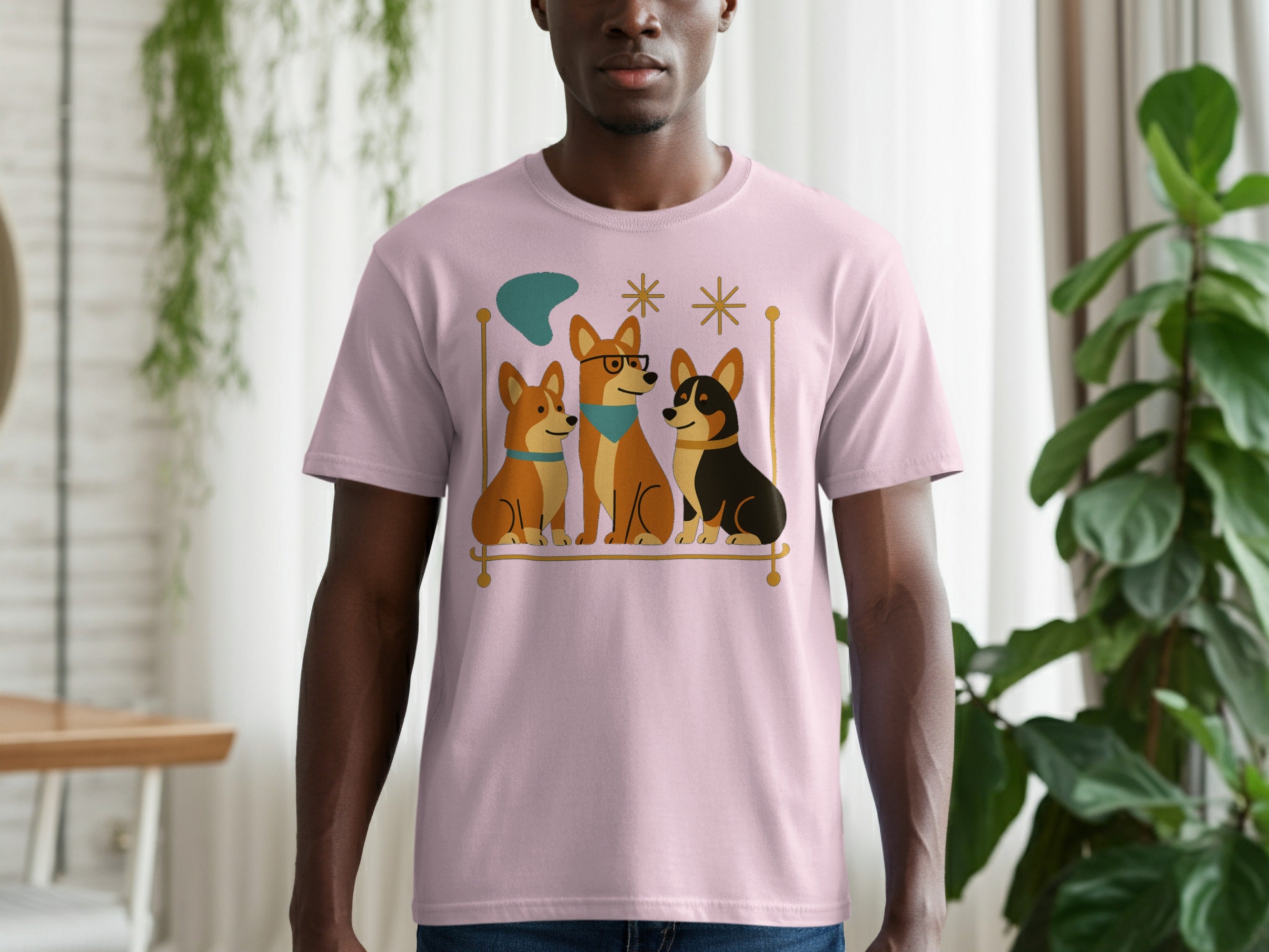Pink t-shirt with three cartoon corgis sitting on a gold bar with mid-century accents.