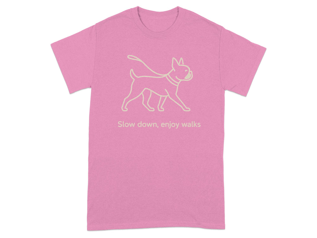 Pink t-shirt with a light line drawing of a dog on a leash and text.