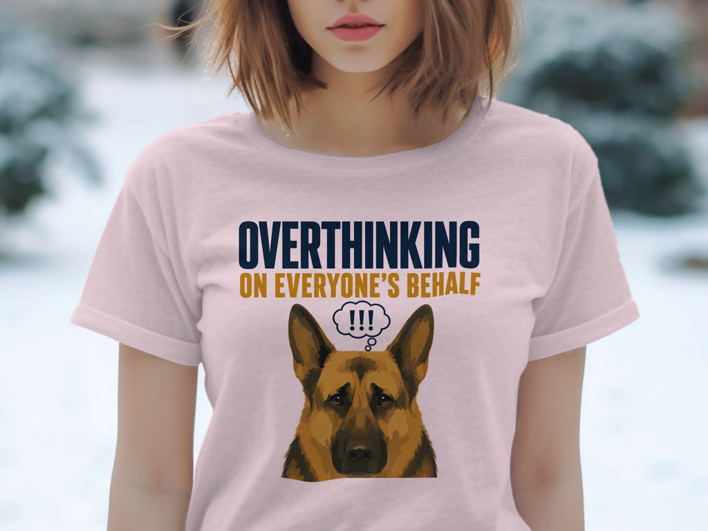 Pink t-shirt with dark blue text "OVERTHINKING ON EVERYONE'S BEHALF" and cartoon dog.