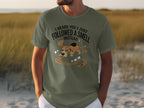 Olive green t-shirt with cartoon dog following a scent trail and text.