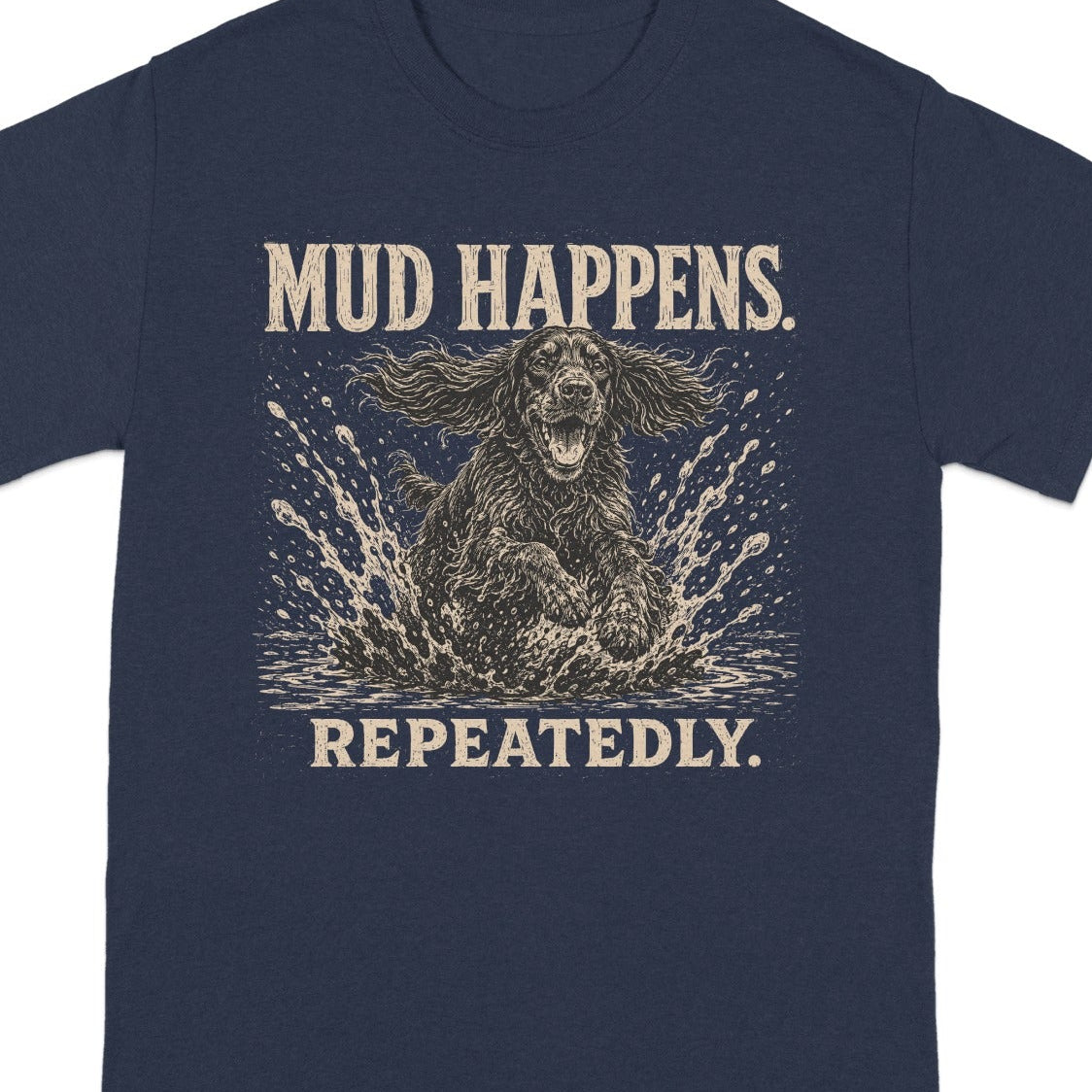 Navy t-shirt with dog splashing through mud, "Mud Happens Repeatedly."