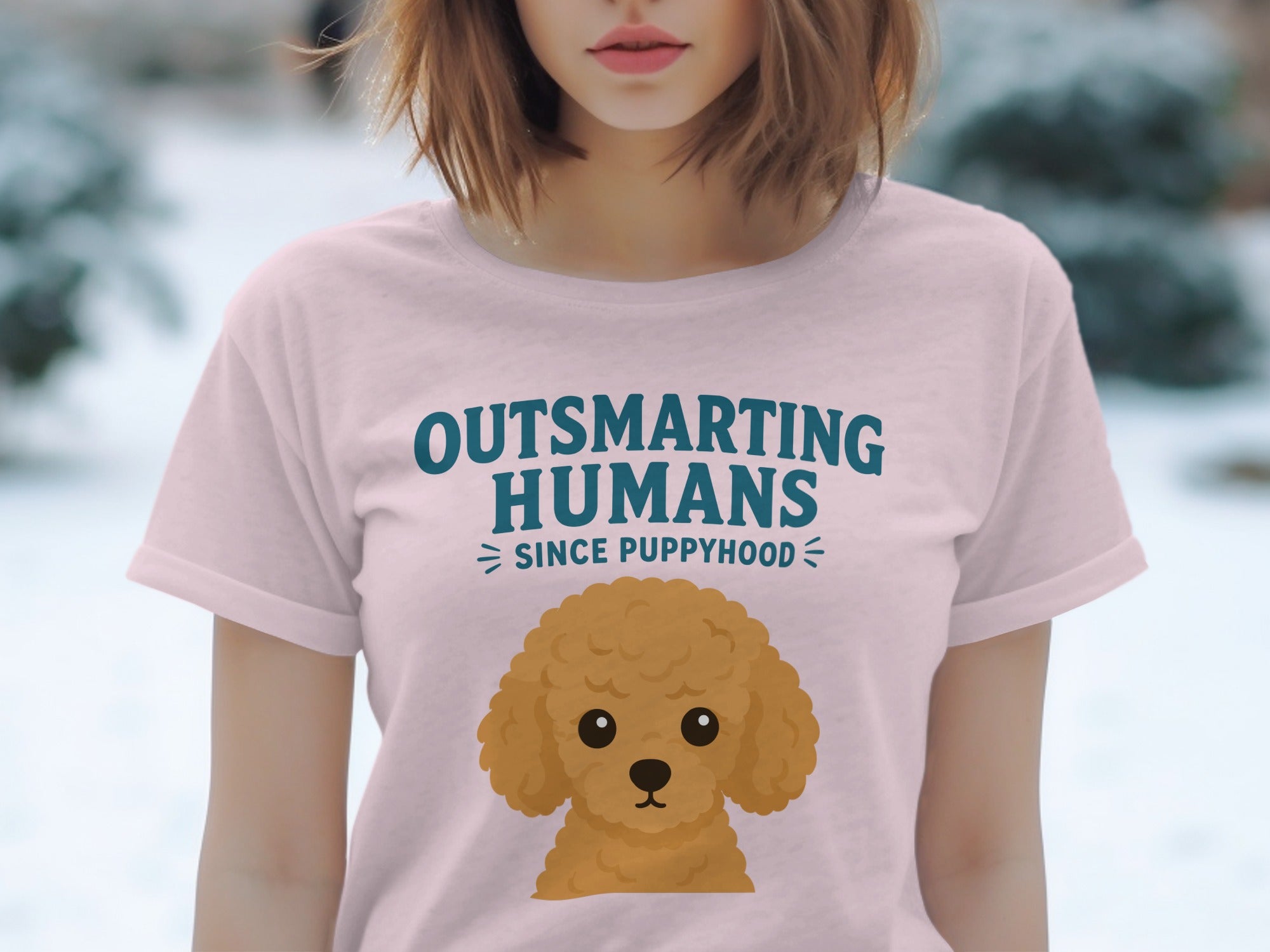 Pink t-shirt with "Outsmarting Humans Since Puppyhood" and poodle graphic.