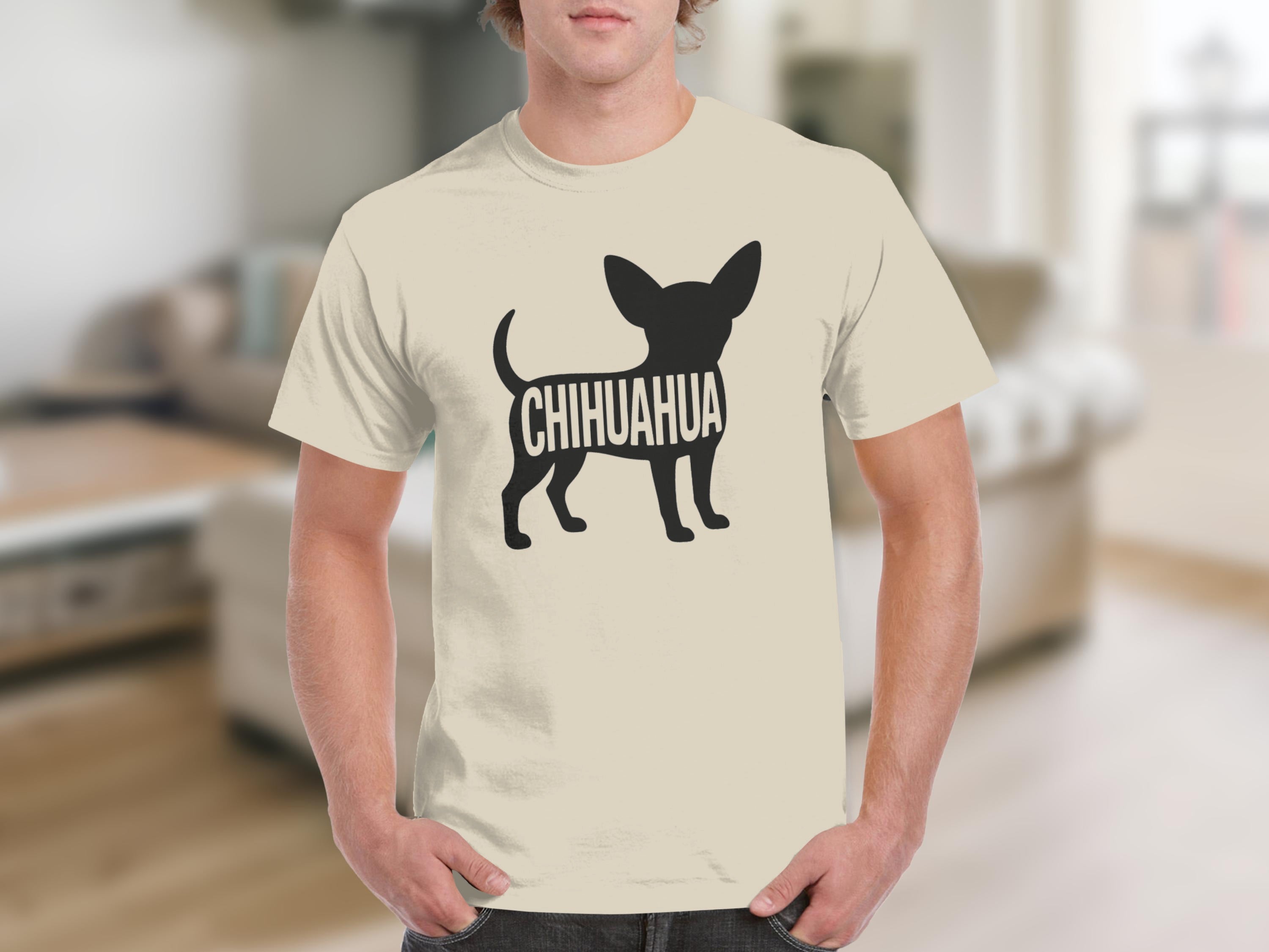 Chihuahua graphic on a cream t-shirt worn by a person.