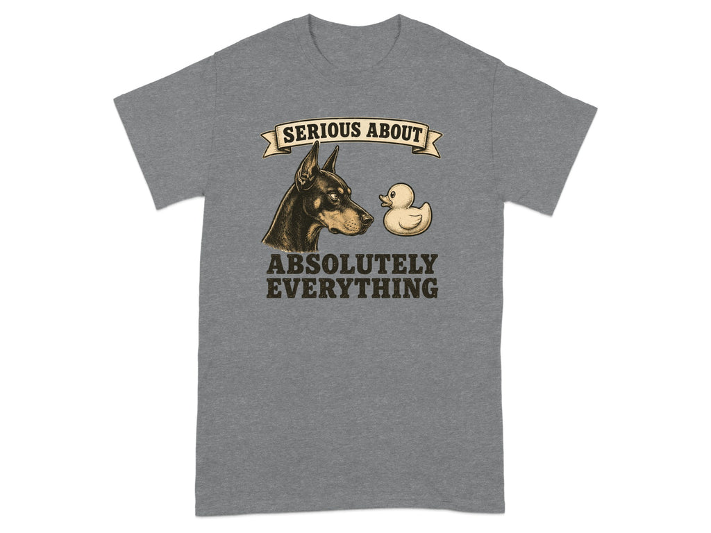 Doberman Pinscher and rubber duck with "SERIOUS ABOUT ABSOLUTELY EVERYTHING" text.