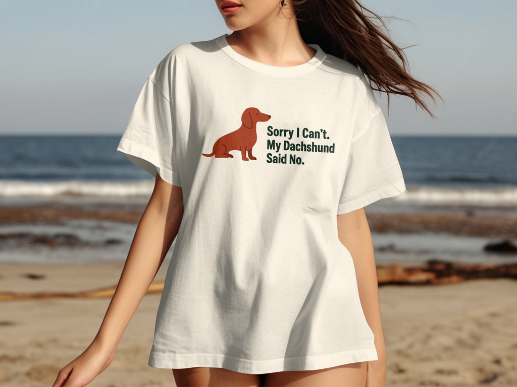 White t-shirt with dachshund graphic and text "Sorry I Can't. My Dachshund Said No."