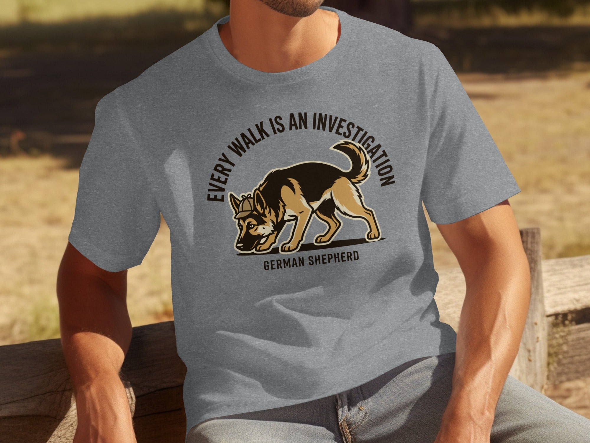 Grey t-shirt featuring a German Shepherd sniffing the ground with text.