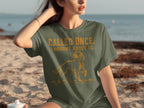 Green t-shirt with dog graphic and text "CALLED ONCE. THOUGHT ABOUT IT."