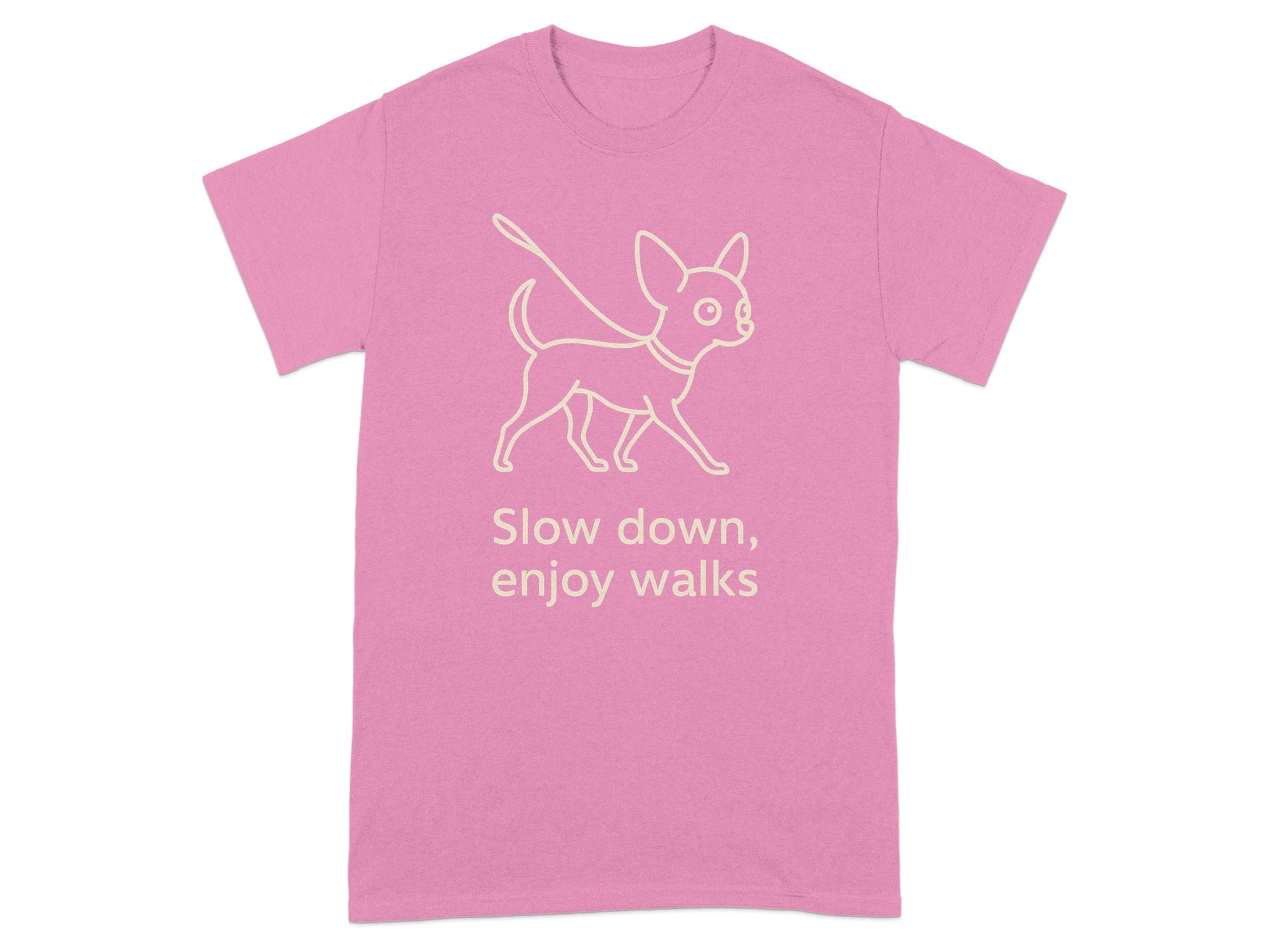 Pink t-shirt with a line drawing of a dog on a leash and text that reads "Slow down, enjoy walks."