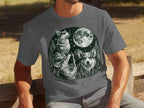 T-shirt graphic of three corgis under a full moon in a forest.