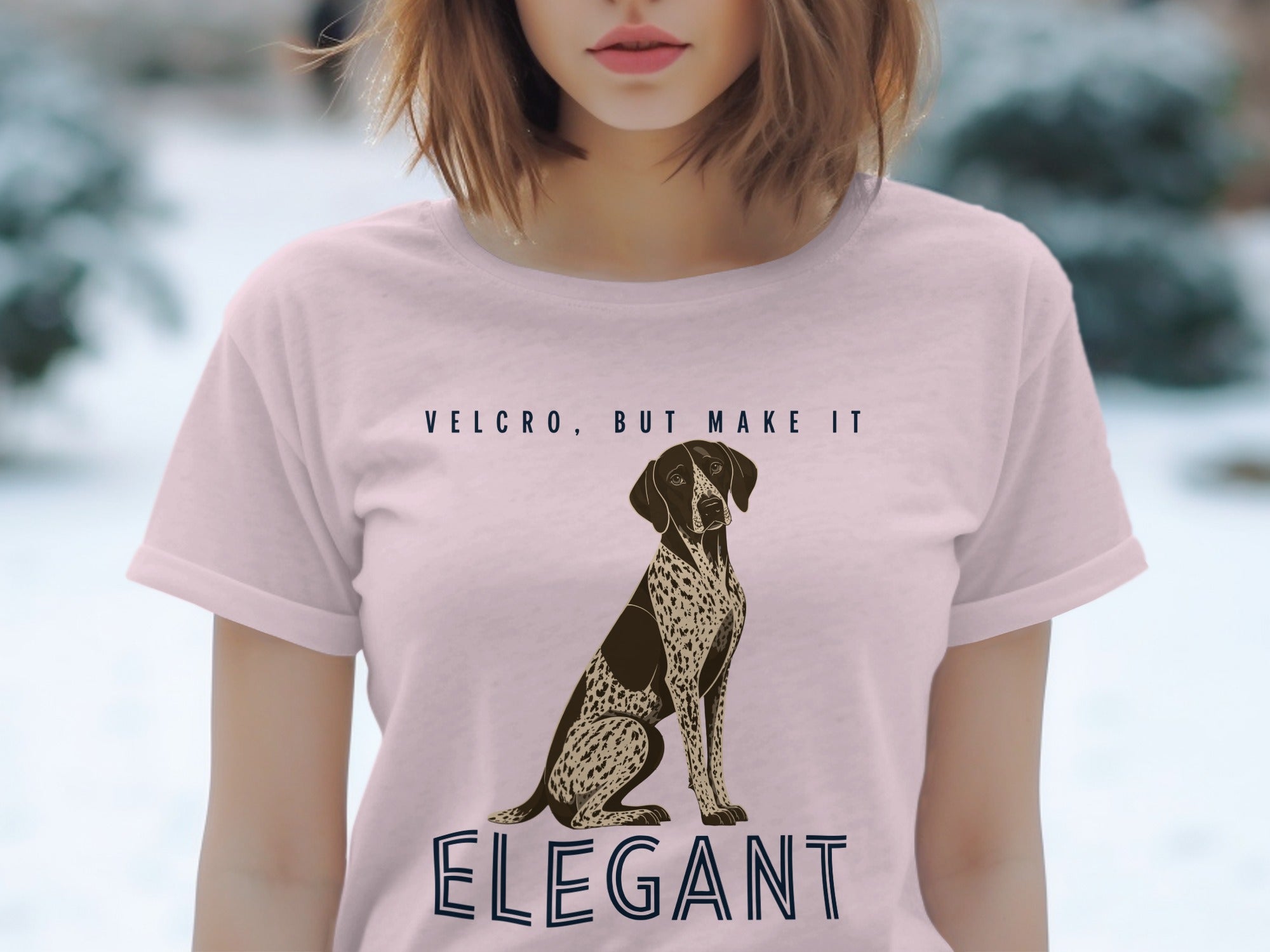 Pink t-shirt with "VELCRO, BUT MAKE IT ELEGANT" and a dog graphic.