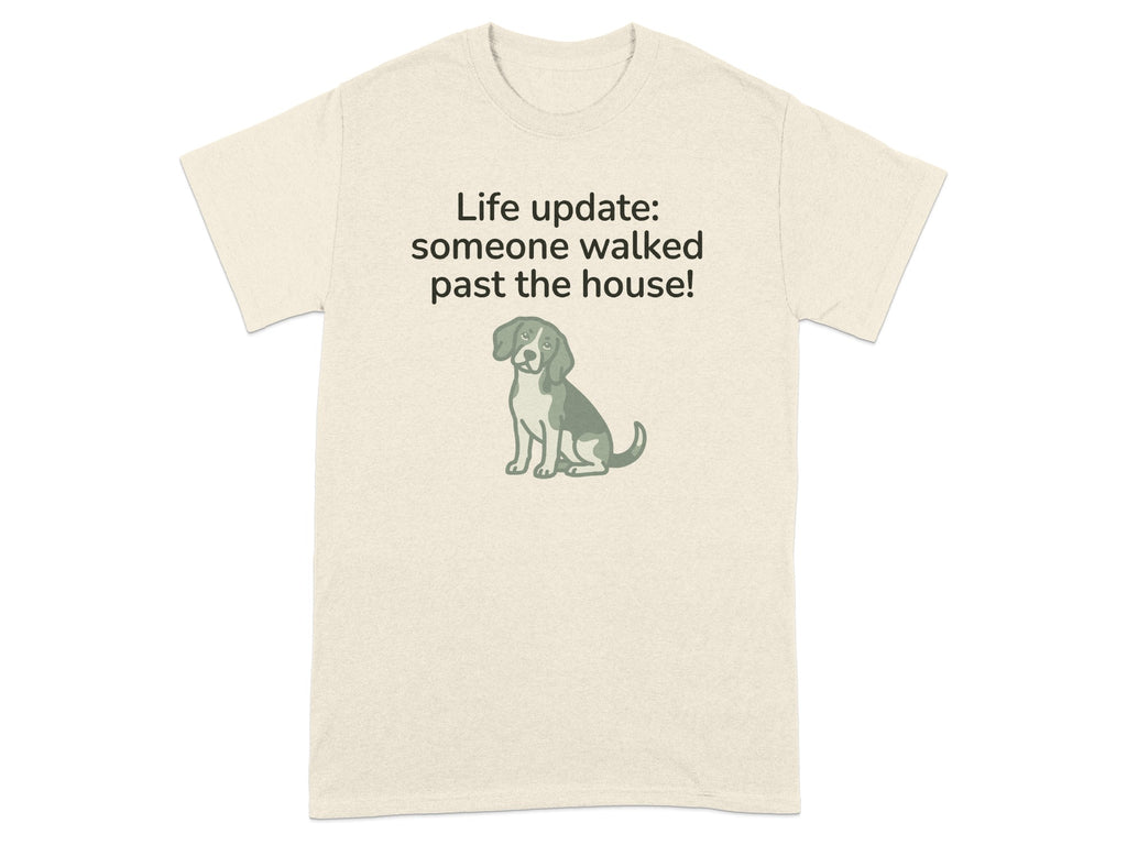 Beige t-shirt with dog graphic and text "Life update: someone walked past the house!"
