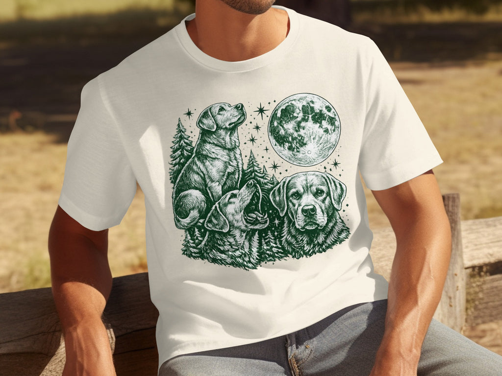Three dogs amidst trees under a full moon with stars on a cream t-shirt.