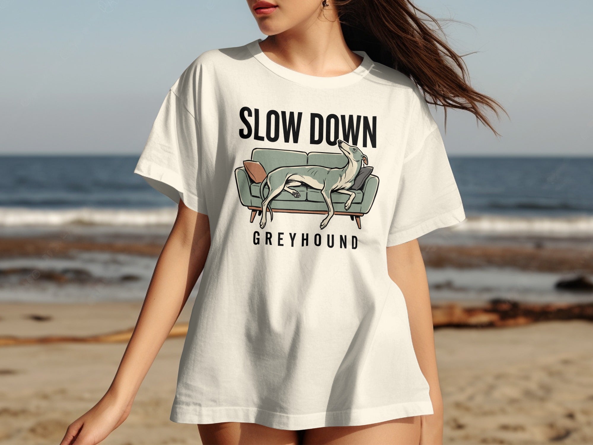 Greyhound on sofa graphic on a white t-shirt.