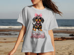 Dachshund wearing pink sunglasses and bow, with text "First of all, I'm a delight".