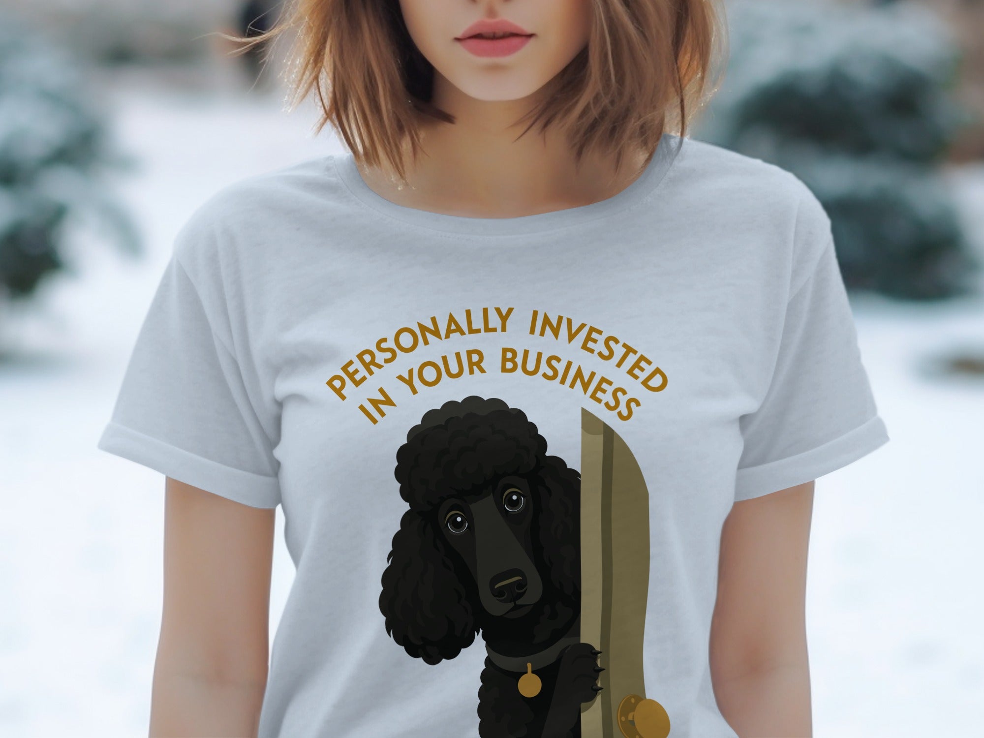 Light grey t-shirt with a black poodle peeking through a doorway.