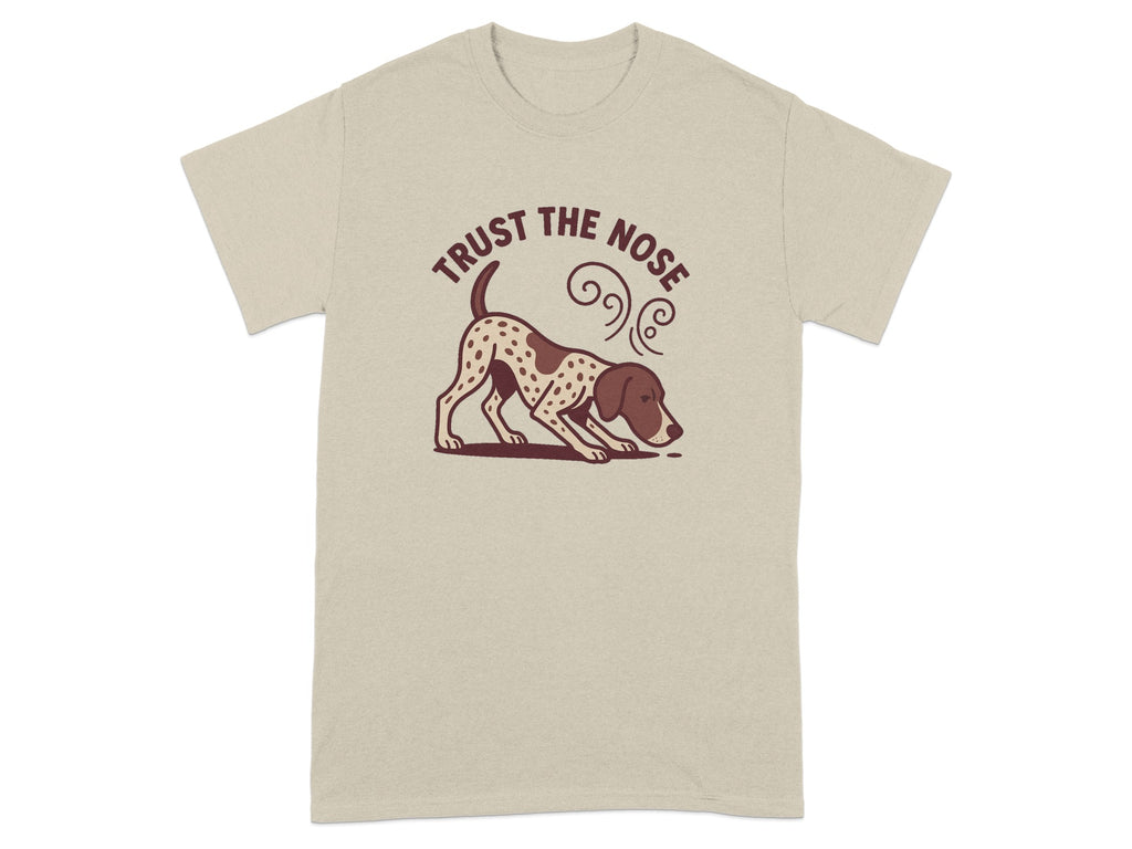 Tan t-shirt with a spotted dog sniffing the ground and text reading "Trust The Nose".