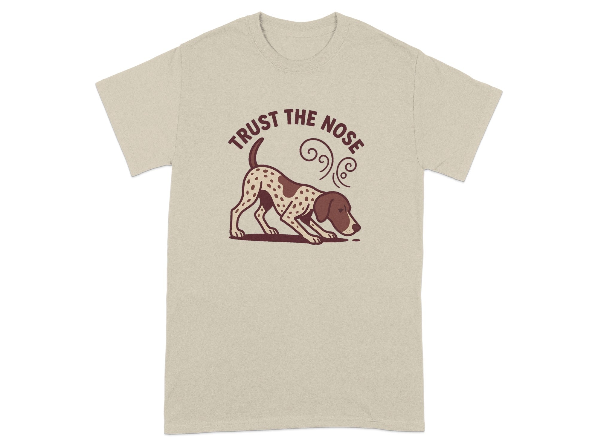 Tan t-shirt with a spotted dog sniffing the ground and text reading "Trust The Nose".