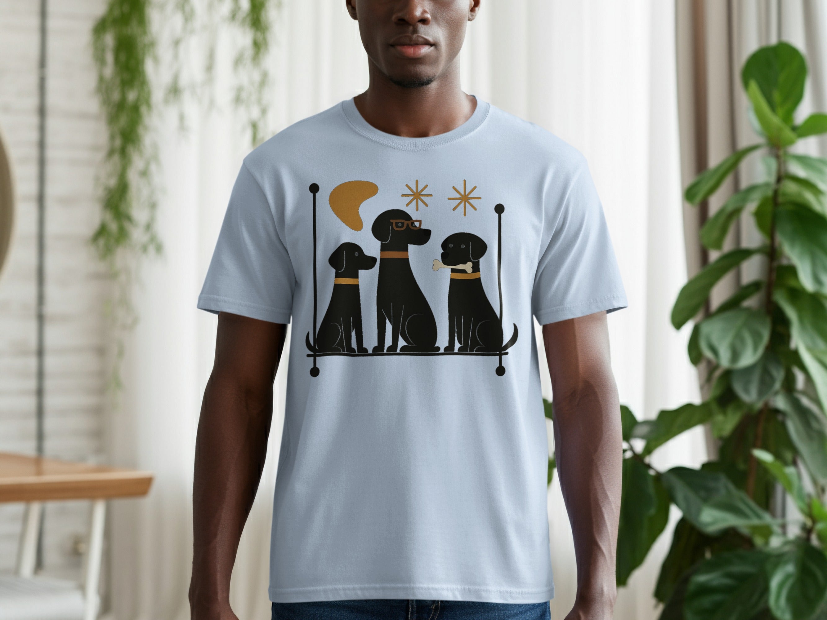 Light blue t-shirt with three black dogs and retro graphic elements.