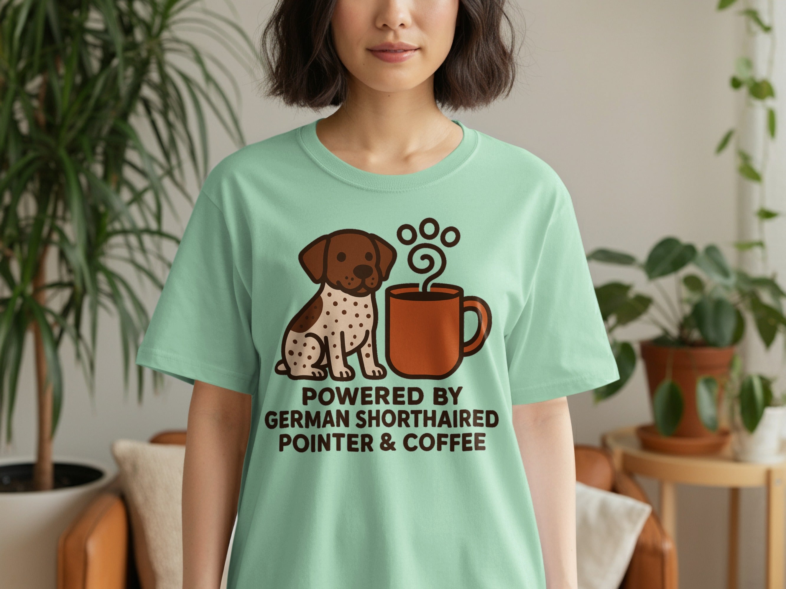 Mint t-shirt with a graphic of a German Shorthaired Pointer next to a coffee cup.