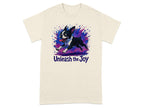 Cream t-shirt with Boston Terrier mid-stride, surrounded by colorful paint splatters, and text "Unleash the Joy".