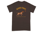 Brown t-shirt with "BIRDS FIRST" and a hunting dog chasing a bird.