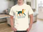 Cream t-shirt with a geometric dog design and the text "feral little creature, perfectly formed".