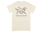 Cream t-shirt with linework drawing of a dog on a leash and text "Slow down, enjoy walks".
