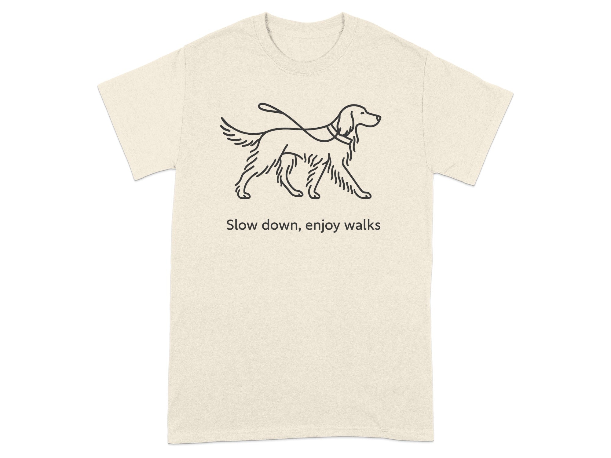 Cream t-shirt with linework drawing of a dog on a leash and text "Slow down, enjoy walks".