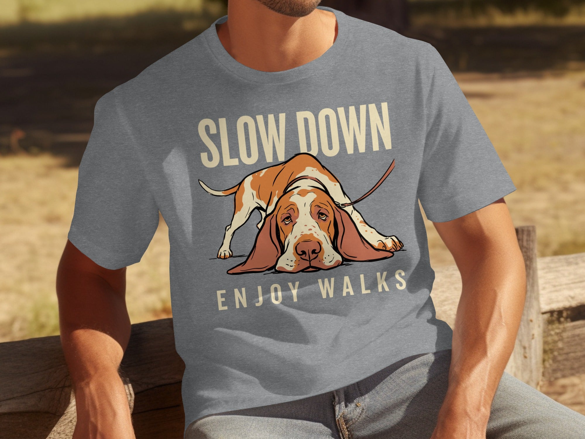 Grey t-shirt with a basset hound lying down and text "SLOW DOWN ENJOY WALKS".