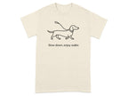 Beige t-shirt with a black dachshund graphic and text "Slow down, enjoy walks".