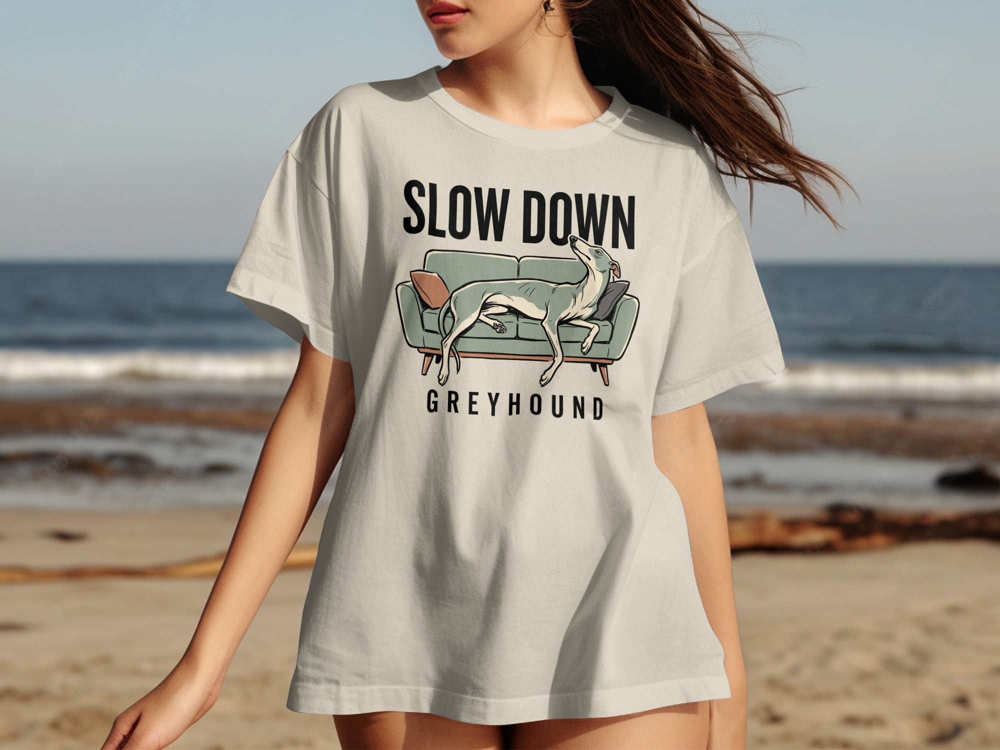 T-shirt with "Slow Down Greyhound" text and dog on couch graphic.