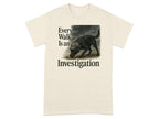 Black dog wearing a hat investigates the ground, with "Every Walk Is an Investigation" text.