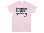 Pink t-shirt with "Professional backtalk specialist" and a small dog.