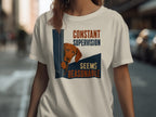 Cream t-shirt with dog peeking around corner, text "CONSTANT SUPERVISION SEEMS REASONABLE".