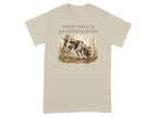 Beige t-shirt with a German Shorthaired Pointer sniffing the ground in a forest.