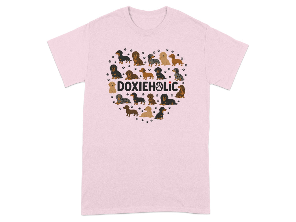 Pink t-shirt with a heart-shaped pattern of dachshunds and paw prints.