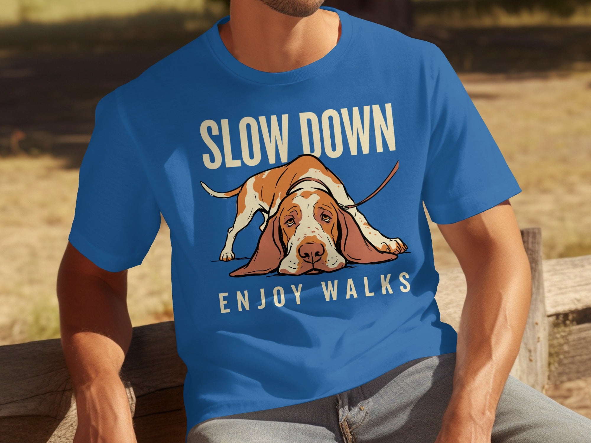 Blue t-shirt with a basset hound graphic and text "SLOW DOWN ENJOY WALKS".