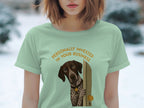 Light green t-shirt featuring a German Shorthaired Pointer peeking through a doorway.