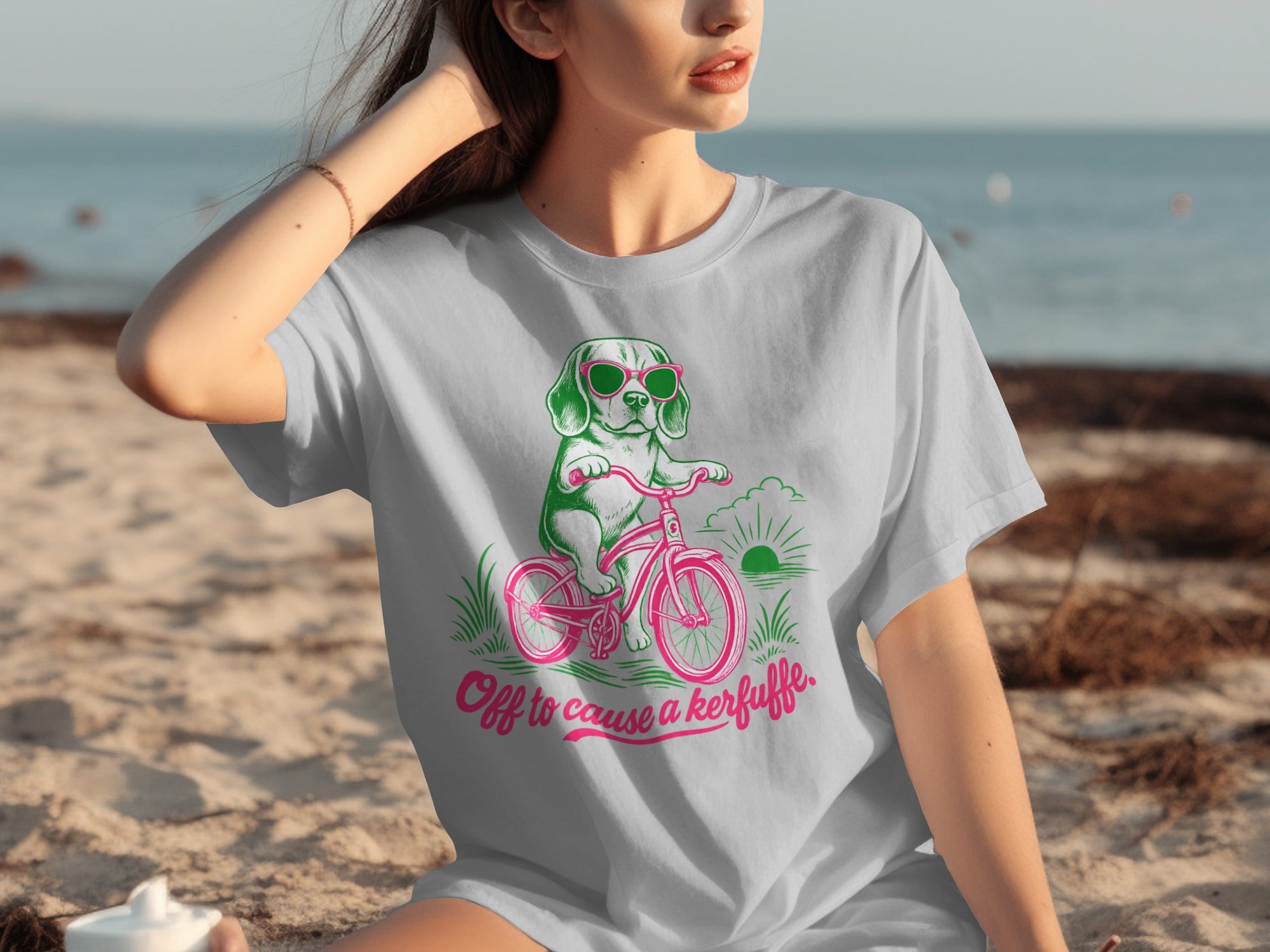 Gray t-shirt with a cartoon dog wearing sunglasses riding a bicycle.