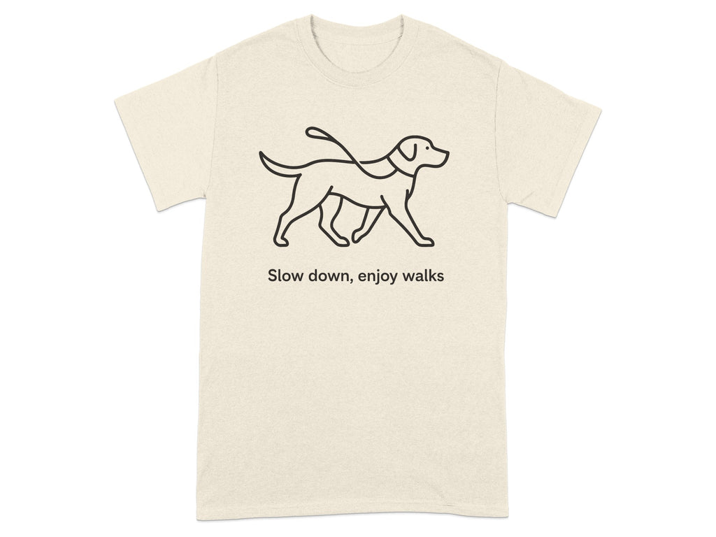 Cream t-shirt with black line drawing of a dog on a leash and text "Slow down, enjoy walks".