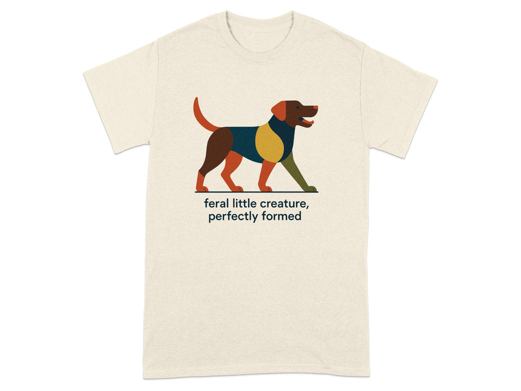 Cream t-shirt with abstract dog art and text "feral little creature, perfectly formed".
