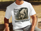 White t-shirt with a poodle in a deerstalker hat and text "Every Walk Is an Investigation."