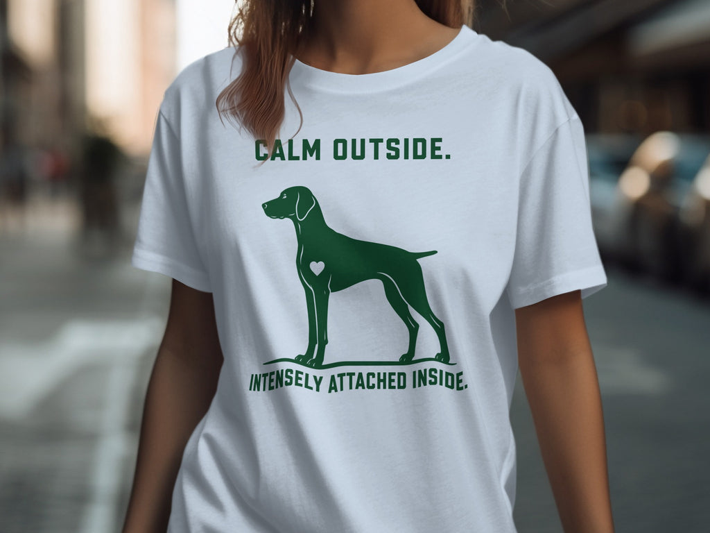 T-shirt with a dog silhouette and text "CALM OUTSIDE. INTENSELY ATTACHED INSIDE."